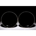 A pair of Chinese monochrome dark aubergine plates with traces of gilding, Kangxi Dia.: 26 cm -