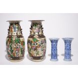 A pair of Chinese blue and white Kangxi vases and a pair of famille rose Nanking vases, 19th C.