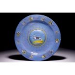 A Haarlem maiolica berretino dish with a hare, early 17th C. Dia.: 34 cm Condition reports and