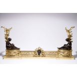 A three-piece patinated and gilt bronze adjustable fireplace fender, France, 19th C. L.: 150 cm -