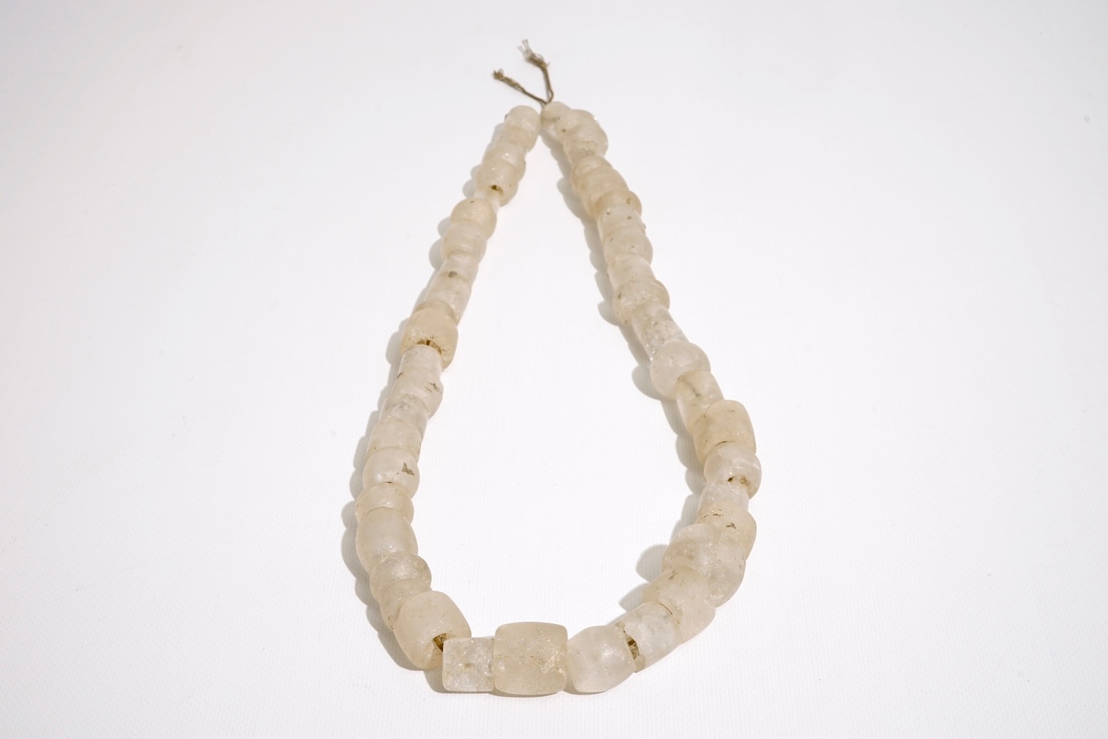 A pre-Columbian rock crystal necklace, Tairona culture carved stone pendants, Colombia, 15/10th C.