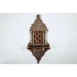 A Syrian wall bracket of wood inlaid with mother of pearl, 19/20th C. Dim.: 58 (h) x 26 (w) cm