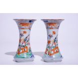 A pair of Dutch Delft polychrome petit feu Kakiemon-style vases, 18th C. H.: 19,5 cm Signed on the