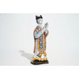 A large Dutch Delft polychrome figure of a standing priest, 18th C. H.: 30 cm Condition reports
