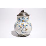 An Italian maiolica compendario style jug with a putto, Faenza, 17th C. H.: 17 cm  Condition reports