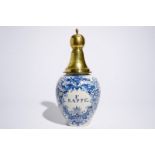 A Dutch Delft blue and white tobacco jar with brass cover, 18th C. H.: 46 cm (incl. cover)