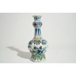 A Dutch Delft garlic neck vase in cashmire palette, 17/18th C. H.: 32,5 cm Condition reports and