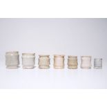 A set of seven white Dutch Delft albarello-shaped ointment jars, 17th C. H.: 8 cm - Dia.: 6,5 cm (