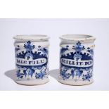 A pair of small Dutch Delft blue and white albarello-shaped pharmacy drug jars, 18th C. H.: 10,5