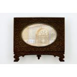 An Indian architectural miniature on ivory in carved ebony frame, 19th C. Dim.: 19 x 16,5 cm (the