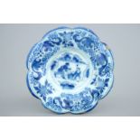 A Dutch Delft blue and white gadrooned chinoiserie dish, 17th C. Dia.: 25,5 cm Condition reports and