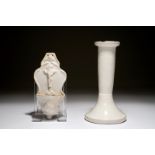 A white Dutch Delft candle stick and a holy water font, 18th C. H: 18 cm (the candlestick)Dim.: 15,5