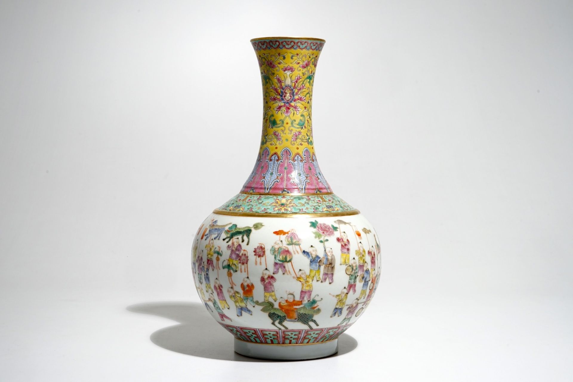 A Chinese famille rose "100 boys" bottle vase, Guangxu mark, 20th C.