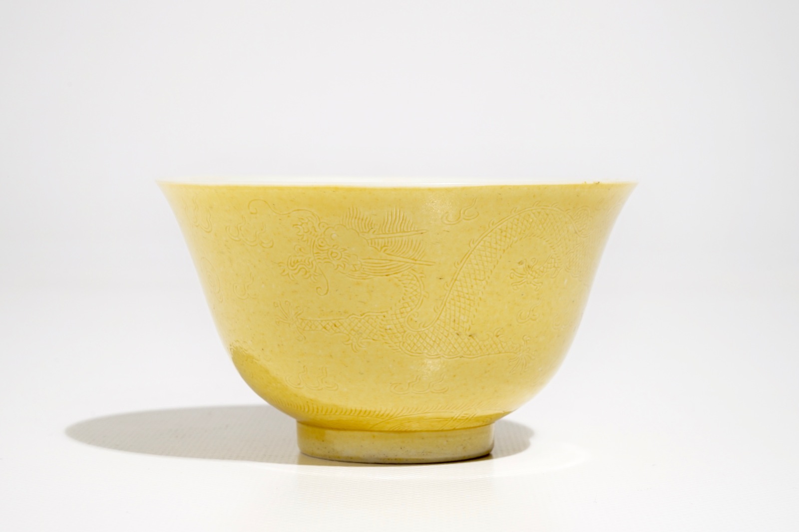 A Chinese yellow-glazed incised dragon bowl, Guangxu mark, 19/20th C.