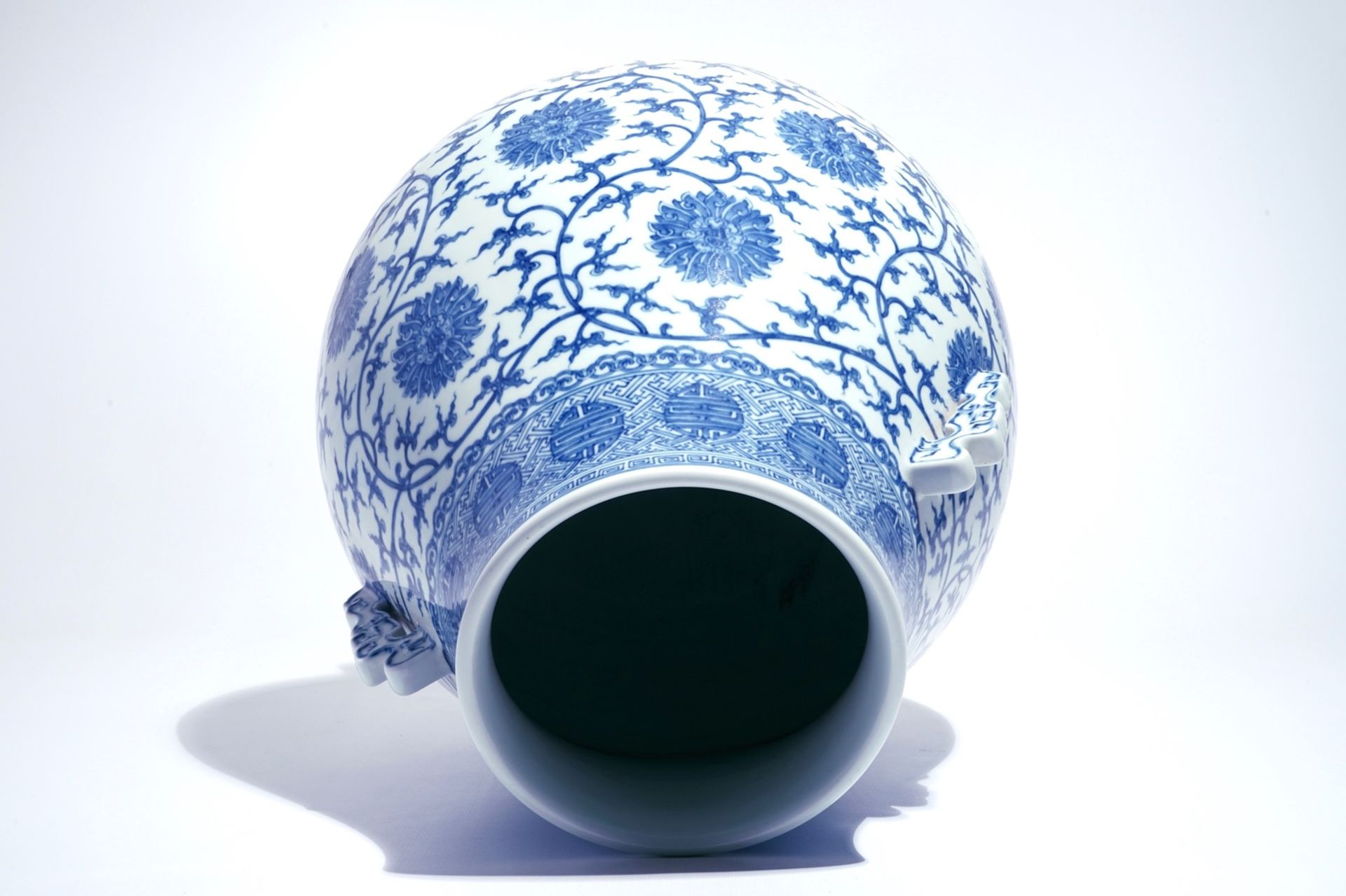 A Chinese blue and white lotus scroll hu vase, Qianlong mark, 20th C. - Image 5 of 6