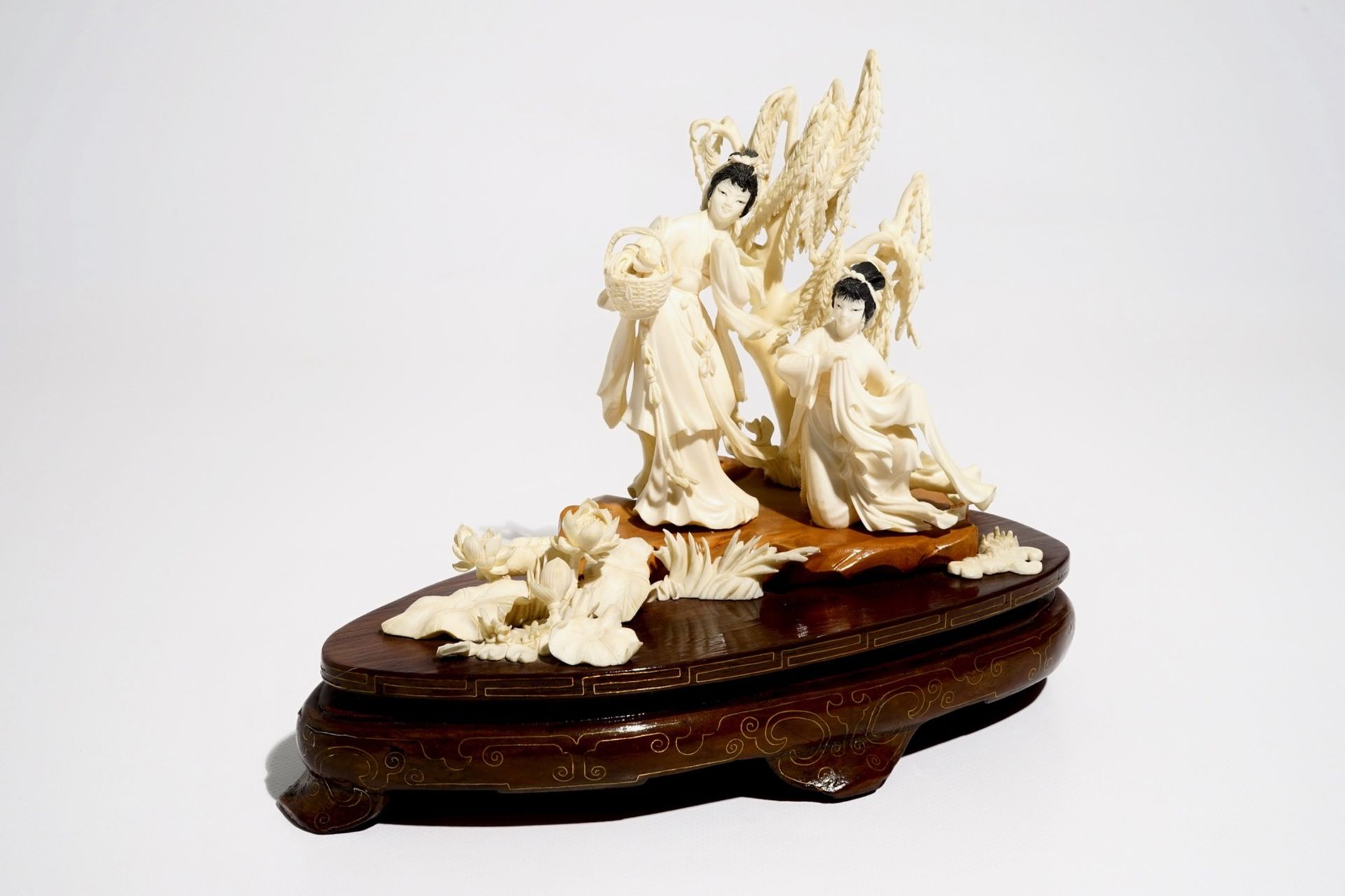 A Chinese carved ivory group of two ladies on wooden base, 2nd quarter 20th C. - Image 6 of 6