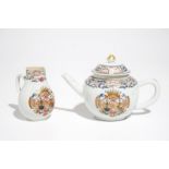 A Chinese famille rose armorial teapot and milk jug, Qianlong