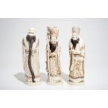 Three signed Japanese ivory okimono of bearded sages, Meiji, early 20th C.