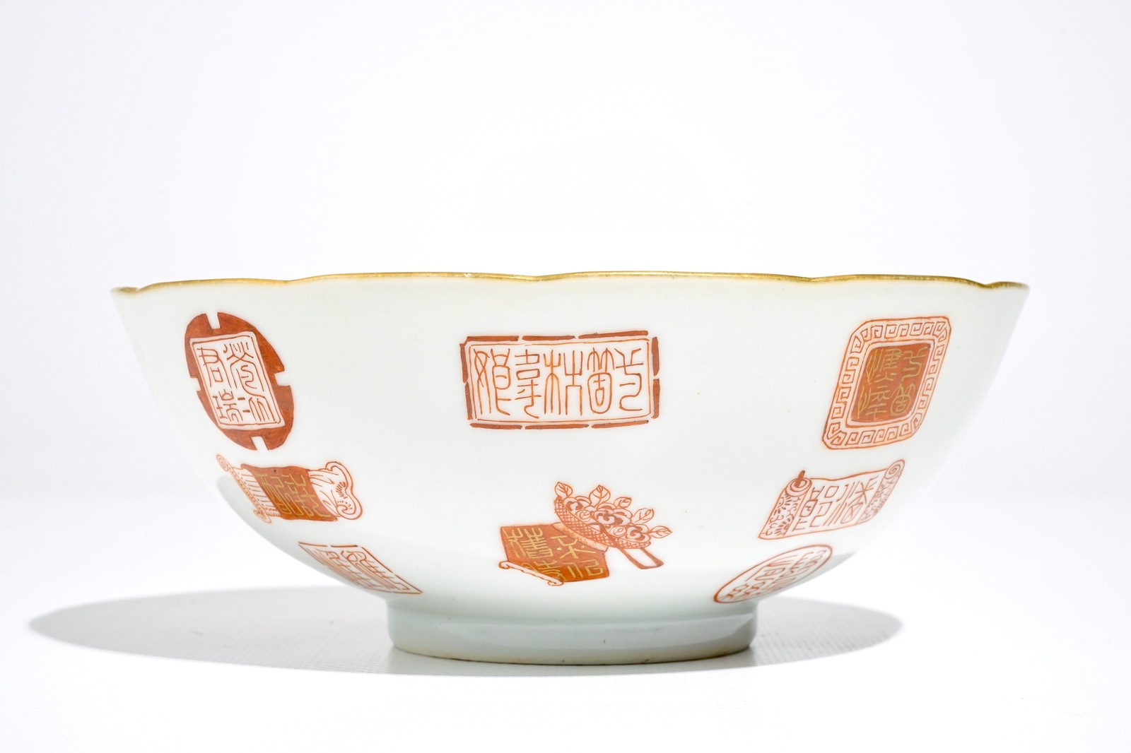 A Chinese iron red and gilt bowl with Taoist symbols and marks, Qianlong mark, 19/20th C. - Image 2 of 6