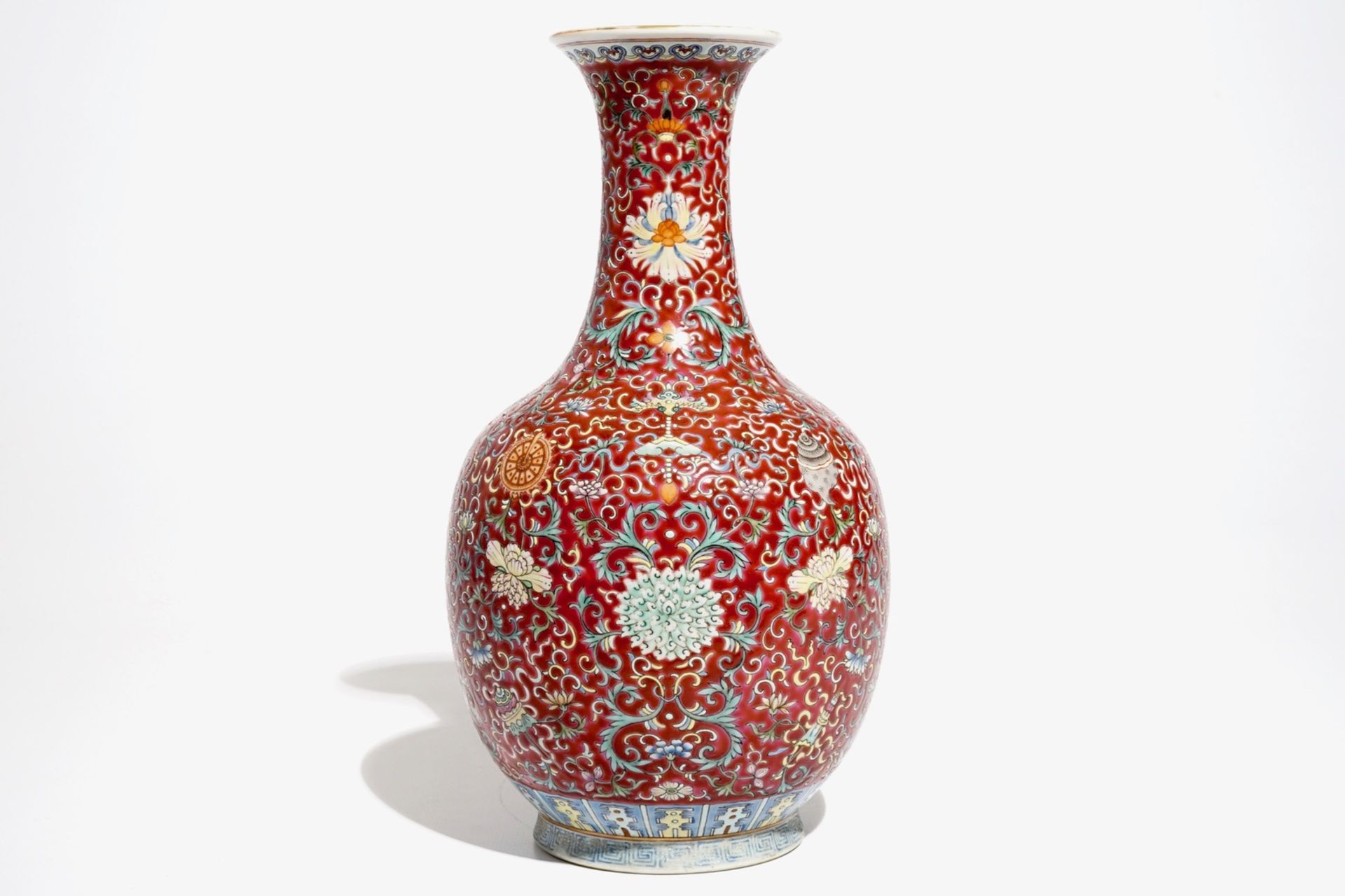 A Chinese red-ground famille rose bottle vase, Qianlong mark, 19/20th C. - Image 4 of 7