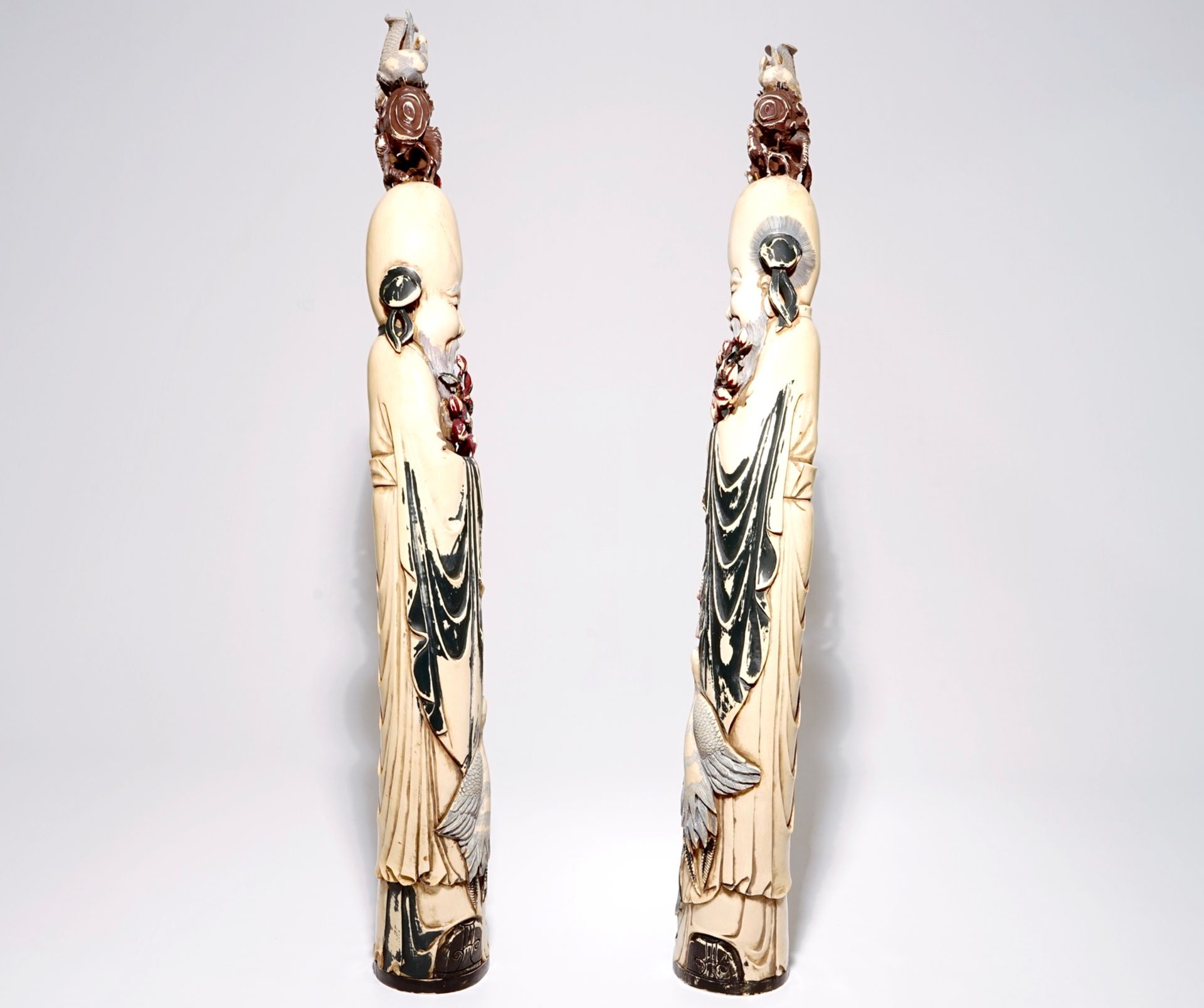 A pair of tall Chinese polychrome carved ivory figures of immortals, 19/20th C. - Image 2 of 6