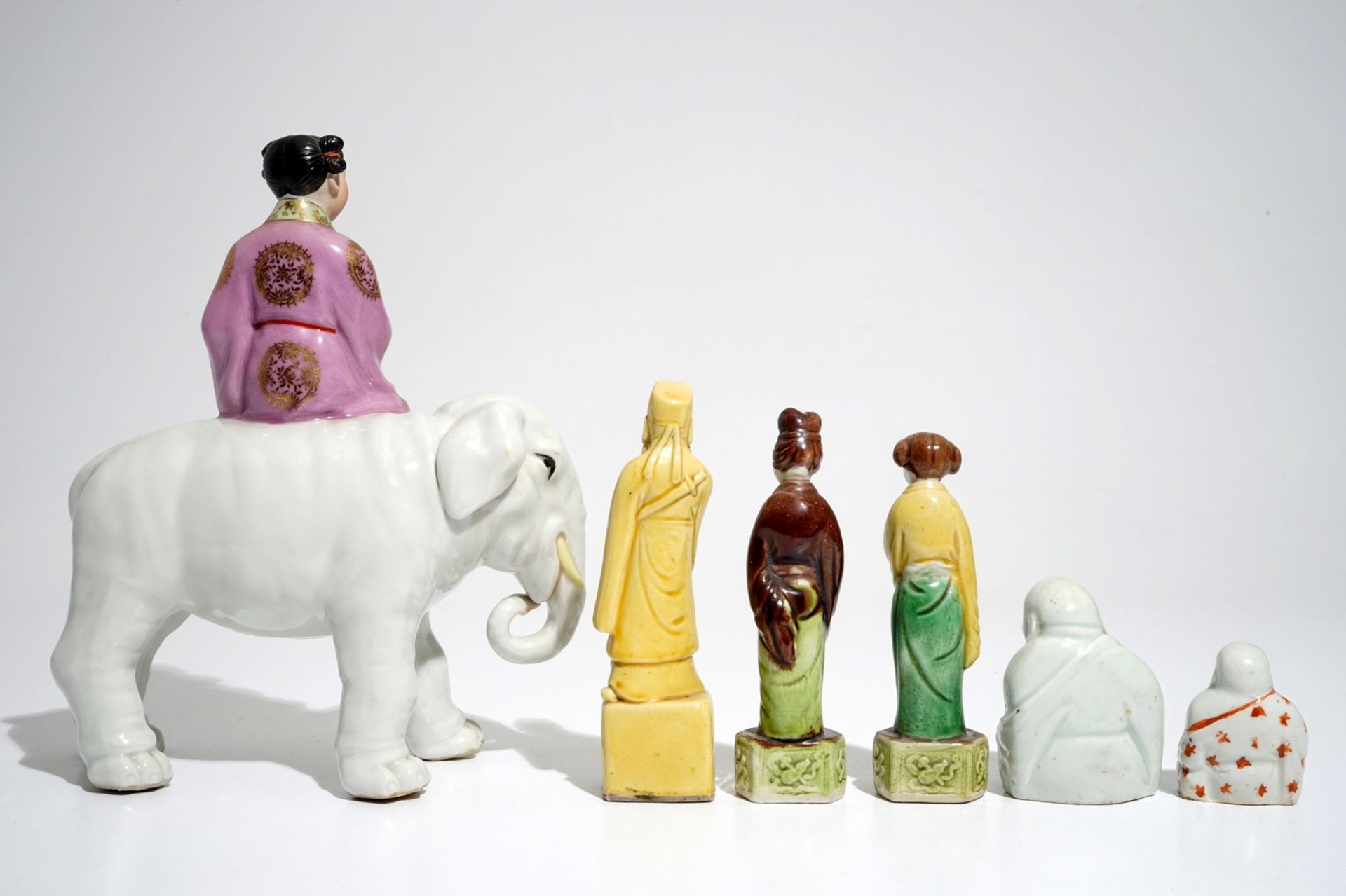Six various Chinese famille rose and sancai-glazed figures, incl. a girl on an elephant, 19/20th C. - Image 4 of 7