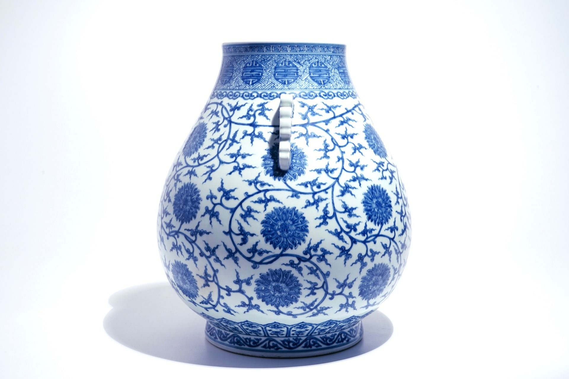 A Chinese blue and white lotus scroll hu vase, Qianlong mark, 20th C. - Image 2 of 6