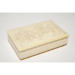 A signed Japanese rectangular carved ivory box and cover, Meiji, 19th C.