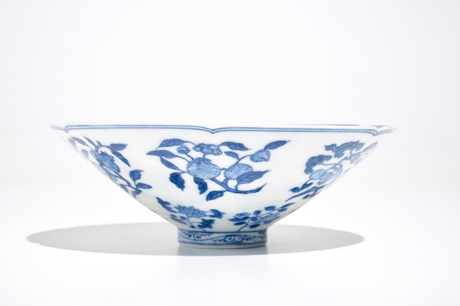 A Chinese blue and white bowl with flowers and fruits, 19th C.