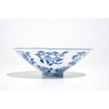 A Chinese blue and white bowl with flowers and fruits, 19th C.
