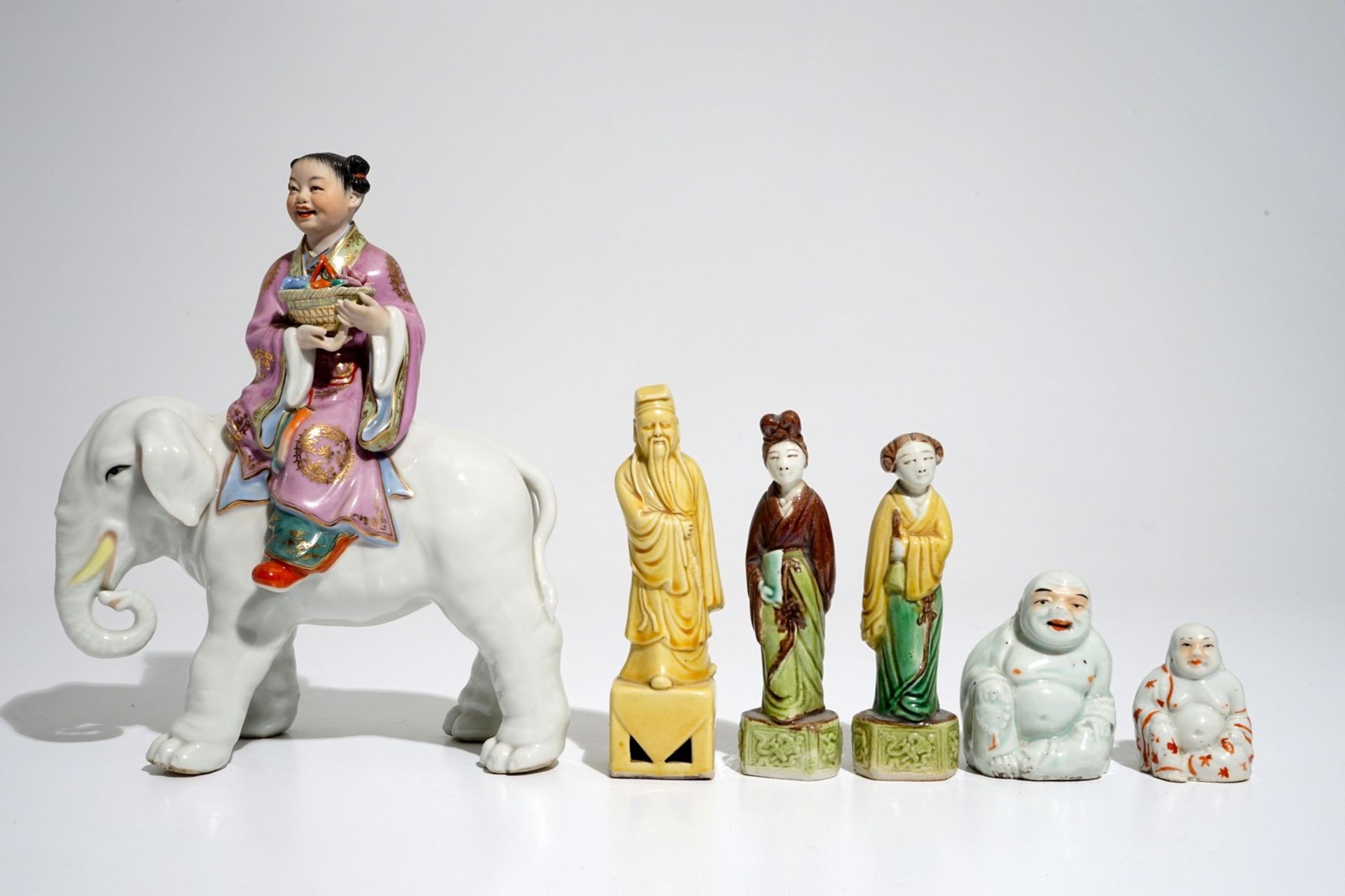 Six various Chinese famille rose and sancai-glazed figures, incl. a girl on an elephant, 19/20th C. - Image 2 of 7