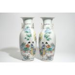 A pair of tall Chinese famille rose vases with figural design and calligraphy, 19/20th C.