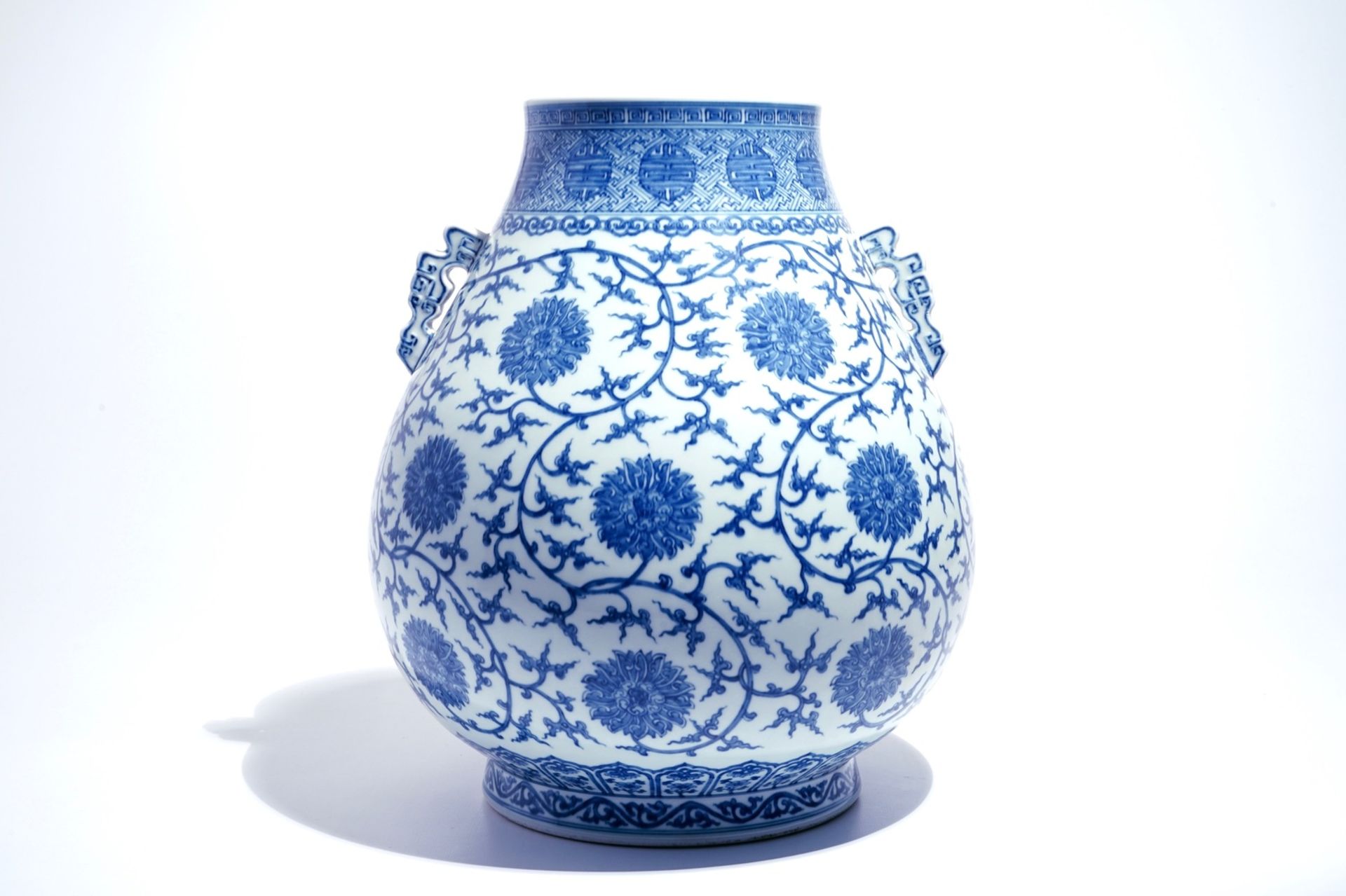 A Chinese blue and white lotus scroll hu vase, Qianlong mark, 20th C. - Image 3 of 6