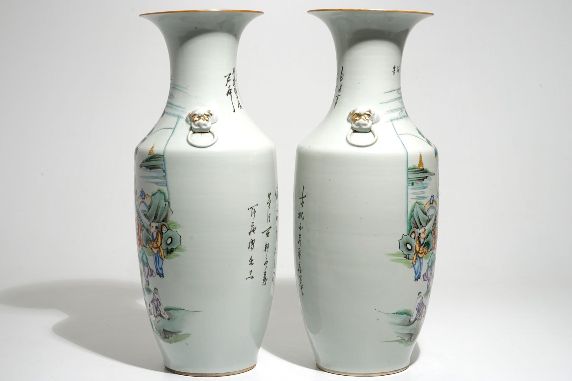 A pair of Chinese famille rose vases with playing boys, 19/20th C. - Image 2 of 6
