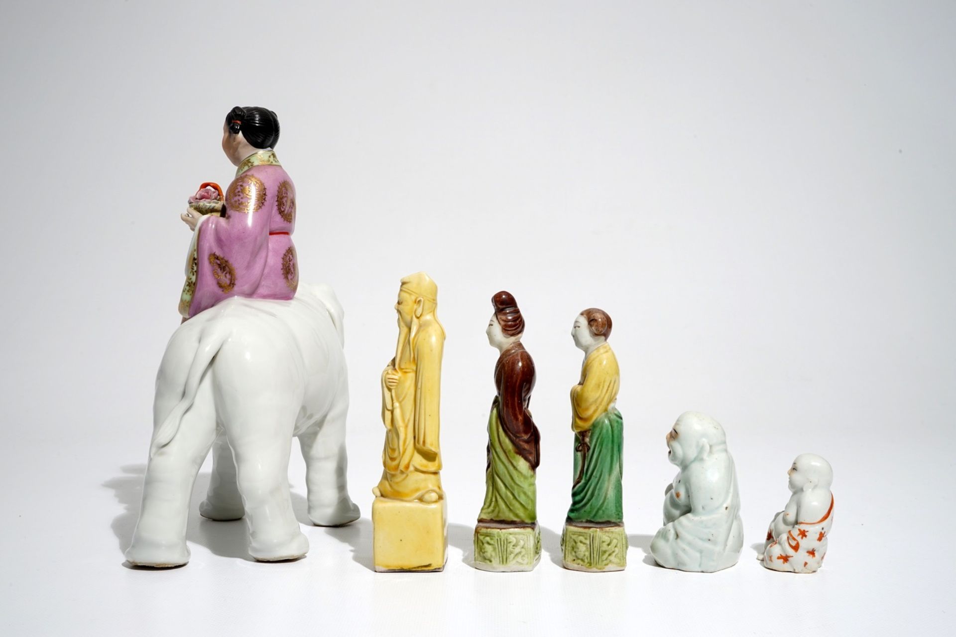 Six various Chinese famille rose and sancai-glazed figures, incl. a girl on an elephant, 19/20th C. - Image 3 of 7