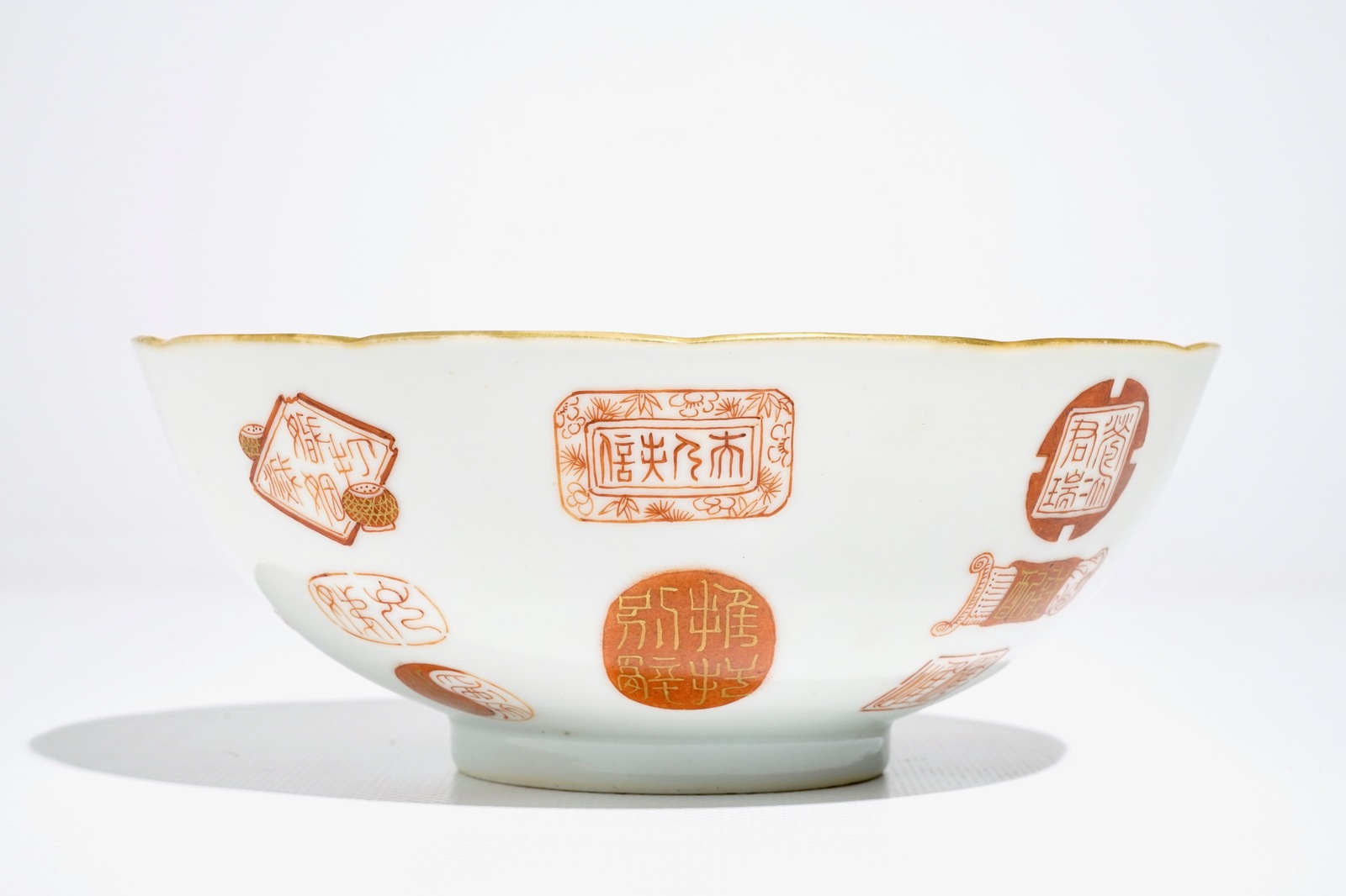 A Chinese iron red and gilt bowl with Taoist symbols and marks, Qianlong mark, 19/20th C. - Image 3 of 6