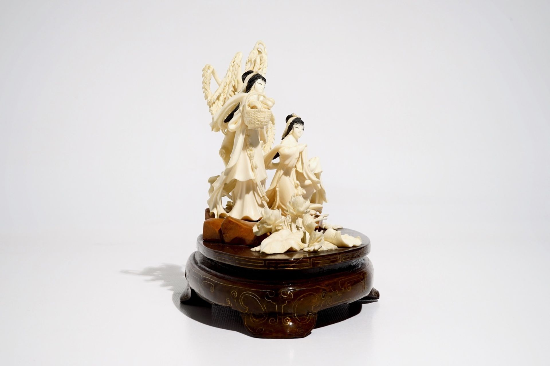 A Chinese carved ivory group of two ladies on wooden base, 2nd quarter 20th C. - Image 2 of 6