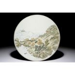 A round Chinese polychrome plaque with a landscape design, 19/20th C.