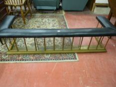 A VICTORIAN BRASS CLUB FENDER, black padded top on twist spindles and stepped base, 43 cms high, 175