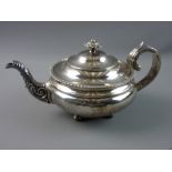 A SILVER TEAPOT of circular bullet form and of stepped design with a narrow pedestal having four