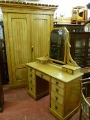 A BLONDE OAK ARTS & CRAFTS TWO PIECE BEDROOM SUITE of Gothic two door wardrobe with castellated