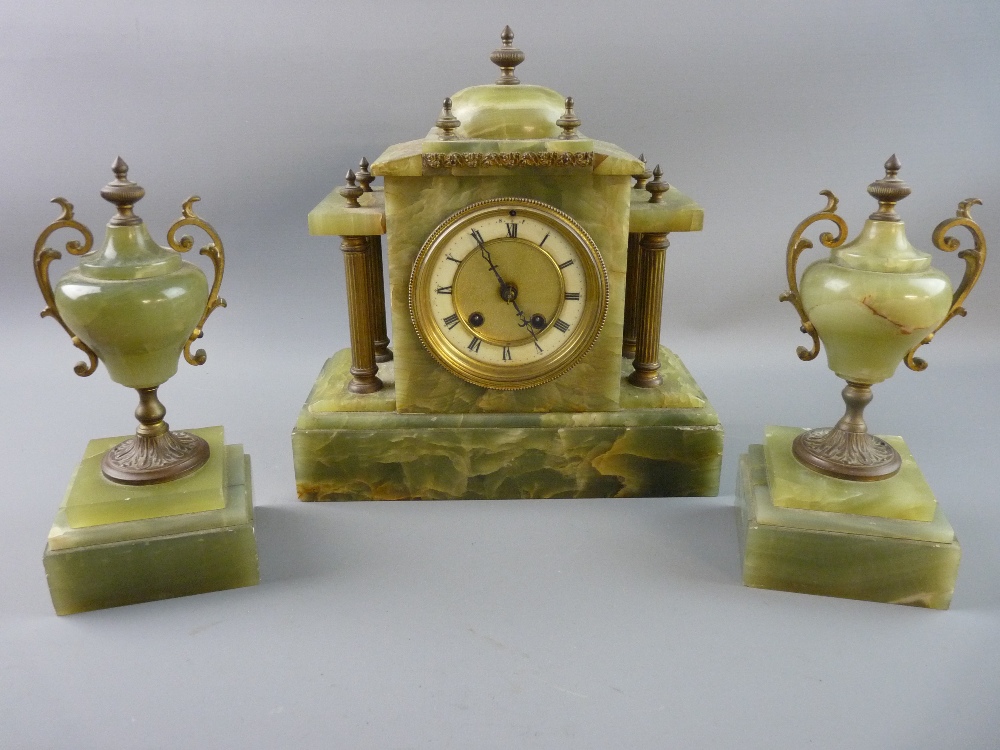 A FRENCH ONYX AND GILT METAL CLOCK GARNITURE, architectural style timepiece with acorn finials and