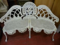 A VICTORIAN CAST IRON GARDEN BENCH, cameo back in style with lattice seat and decorative apron on