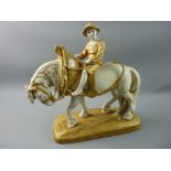 A ROYAL DUX FIGURE OF A YOUNG BOY on a plough horse, the porcelain decorated in muted ivory tones