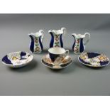 A SLIGHTLY GRADUATED SET OF THREE GAUDY WELSH MILK JUGS (pattern unidentified), 10, 11 and 12 cms