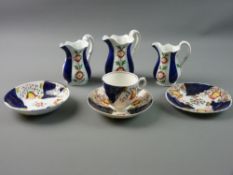 A SLIGHTLY GRADUATED SET OF THREE GAUDY WELSH MILK JUGS (pattern unidentified), 10, 11 and 12 cms