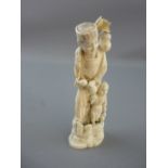 A JAPANESE CARVED IVORY STANDING FIGURE, 19th/20th Century, one piece carving of a man with his