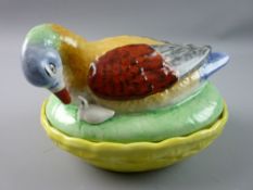 A LATE 19th CENTURY STAFFORDSHIRE POTTERY DUCK ON NEST with young by its side, well coloured and