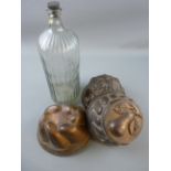 THREE VINTAGE TINWARE COPPER COLOURED JELLY MOULDS and a large ribbed 'Poison' bottle, 37 cms high