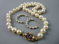 A NATURAL PEARL NECKLACE of non-graduated pearls with a fine nine carat gold scrolled clasp with